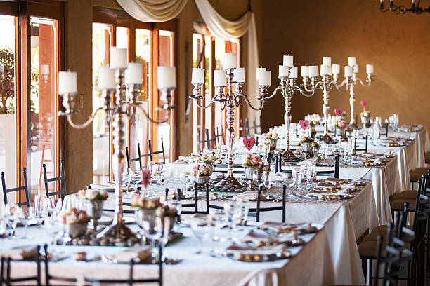 Hall at a wedding reception with decorated tables